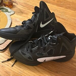 Black like new Nike high tops.